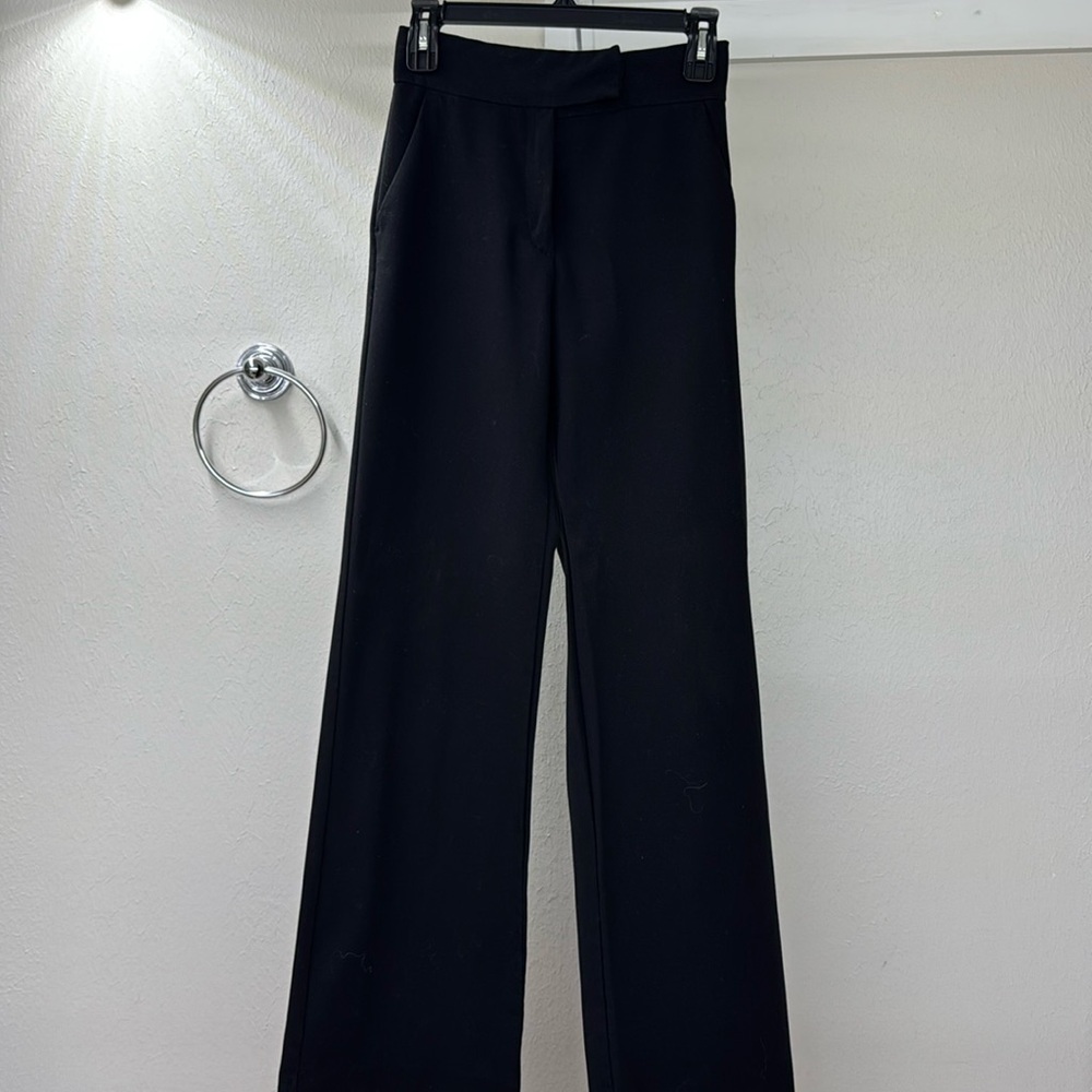 Black H&M work trousers with two types of buttons/closures